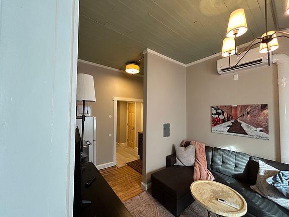 Living room featuring 10 foot ceilings.