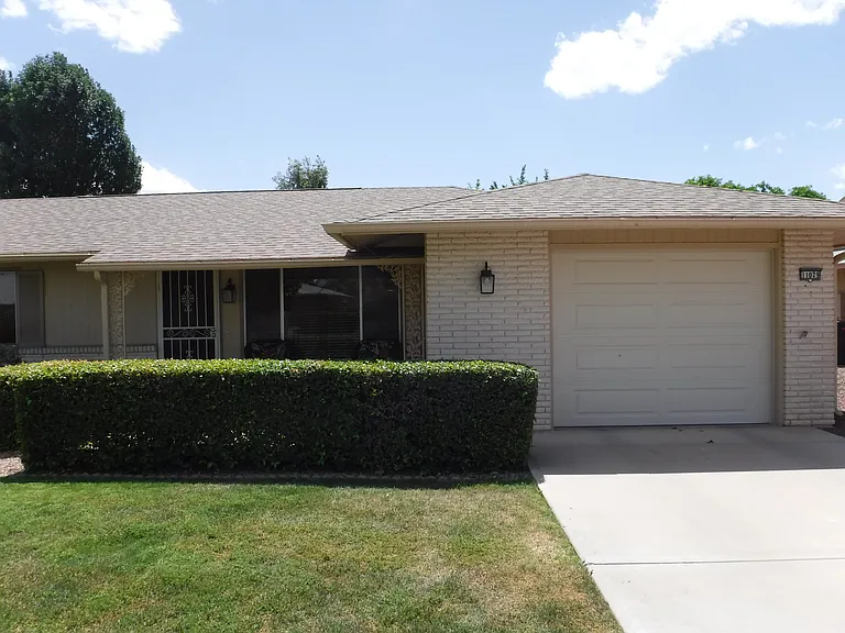 Front door and garage of condo.