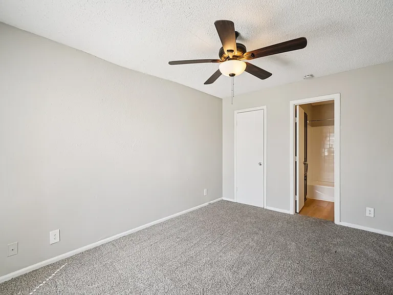 Welcome to The Riley Apartments, where modern comfort meets style. Enjoy spacious, well-lit interiors featuring plush carpeting and ceiling fans for a touch of elegance. Come see your new home today! Schedule your tour now.