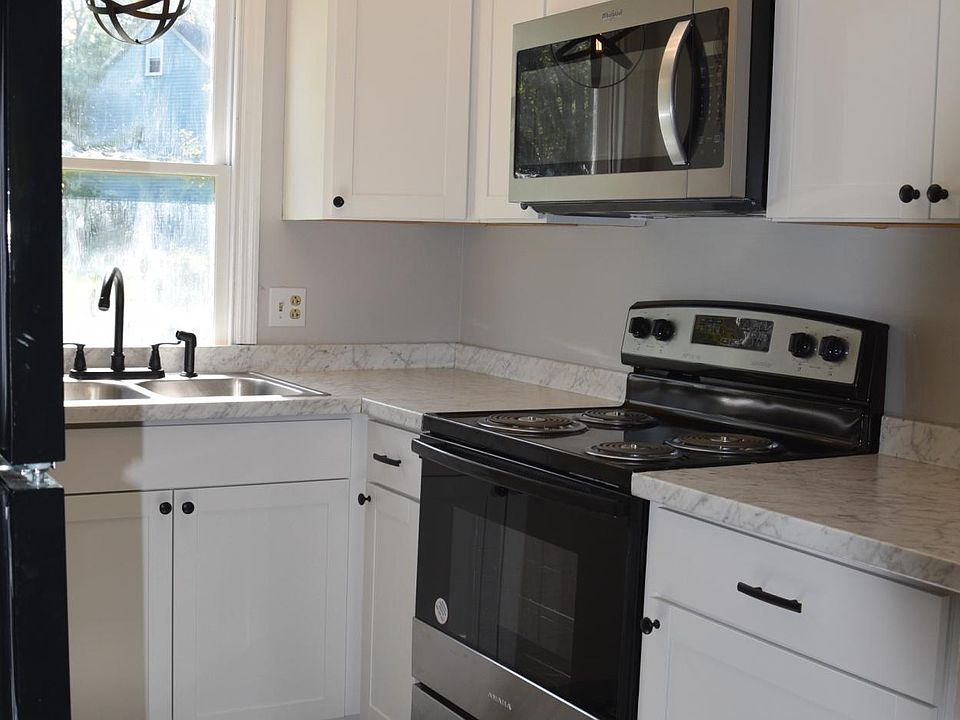 All new kitchen with new cabinets, floor, appliances, and lighting