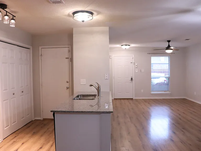 Laundry closet with hook ups.