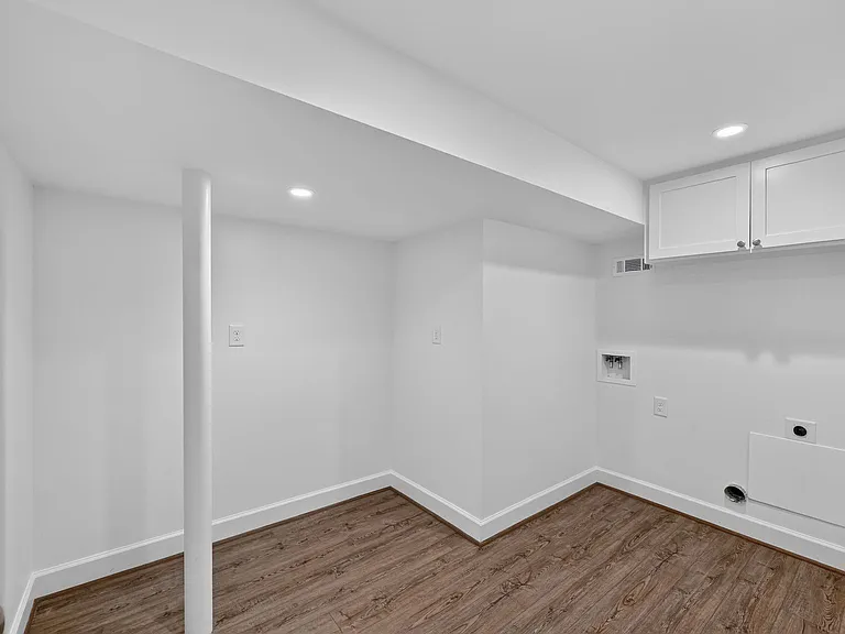 Large laundry room with hookups for side by side washer/dryer (not included). Additional space for drying racks, craft or wrapping table - you can make it what works for you.