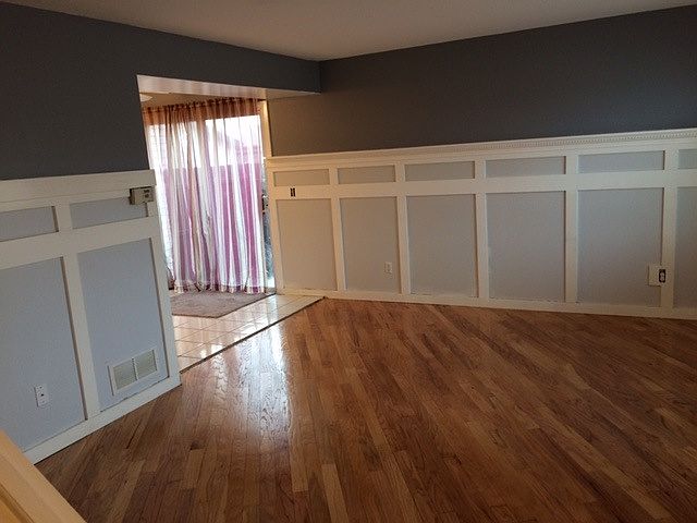 Living room and doorway to dining/kitchen and atio
