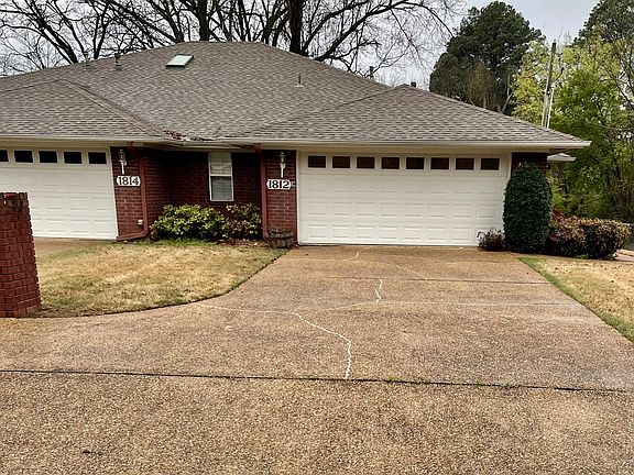 All brick, extra insulated and well-maintained duplex w/ two-car garage and attic storage.