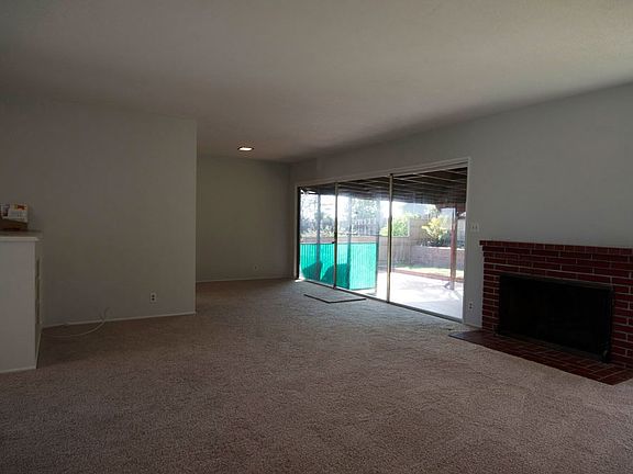 Huge windows in living area with backyard views