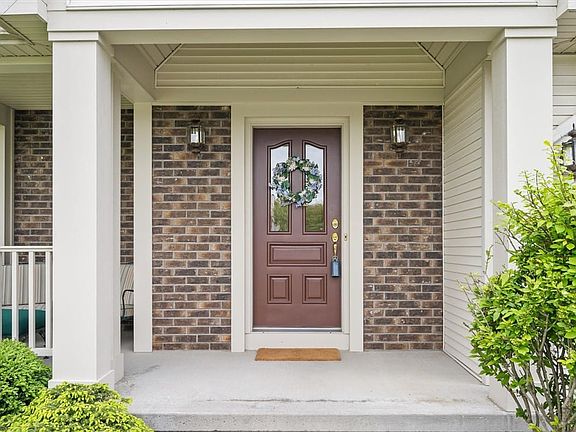 Front entrance with brick accents.