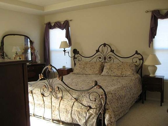Master Bedroom w/ceiling fan, his/her closets, and adjoining master bath