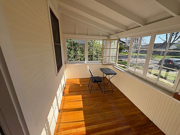 Sun Porch, all the window open, beautiful place to site in the morning