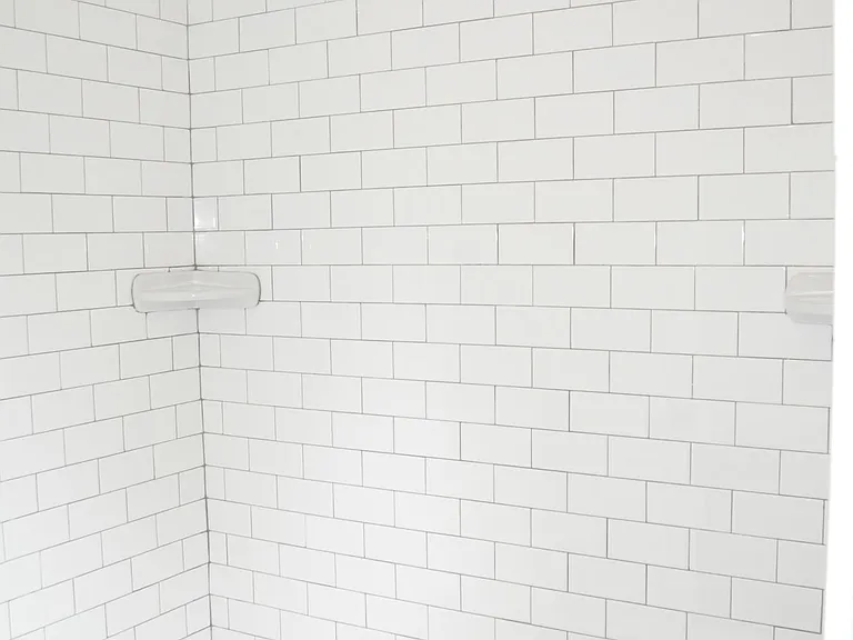 Shower with subway tile.