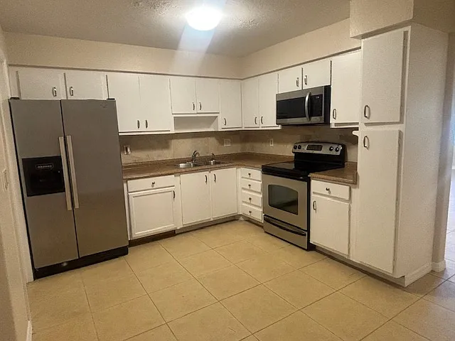 Comfortable spacious kitchen with stainless steel appliances