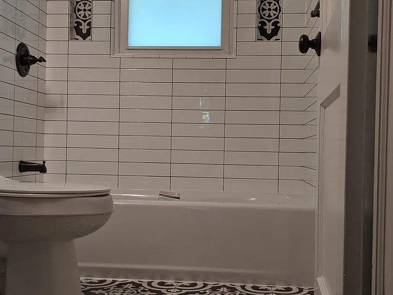 Newly renovated tile bathroom with floor radiant heating