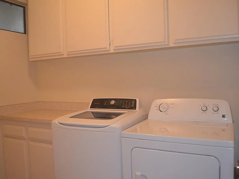 Laundry room with washer and dryer inside the unit