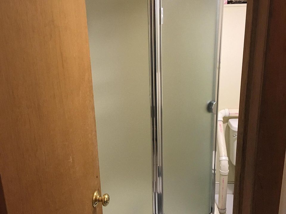 Small compact bathroom with enclosed shower. Good water pressure.