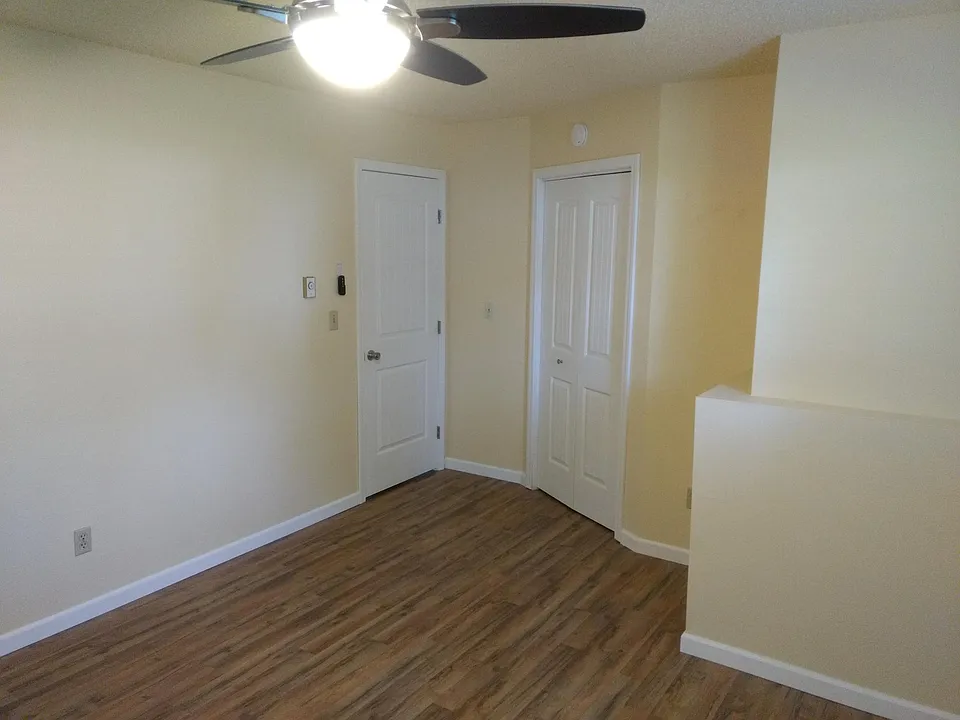 Master bedroom with entry door and door to walk in closet. C