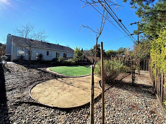Large, fully fenced backyard.