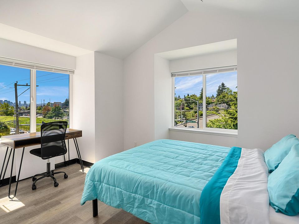 Furnished bedroom with views and vaulted ceilings