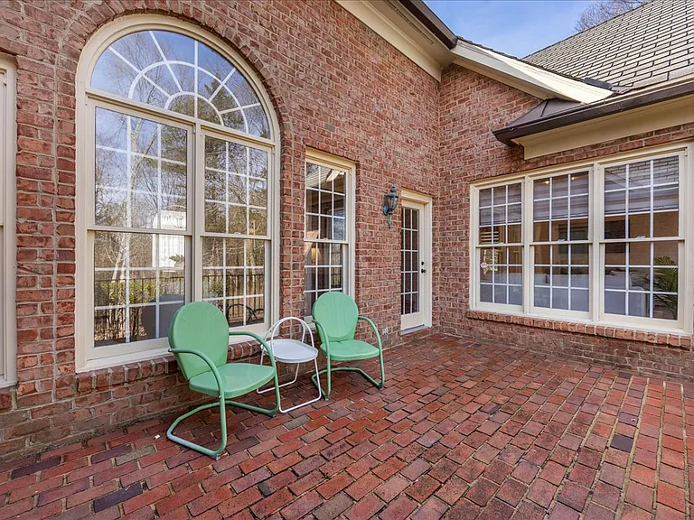 Patio with access from principal bedroom and open concept great room.