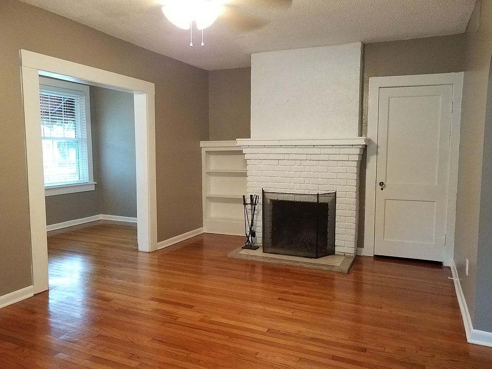 Large Living room, with view of Sun room and working Firepla