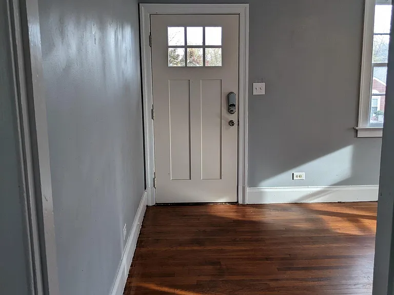 Standing at bathroom door looking to front door.
