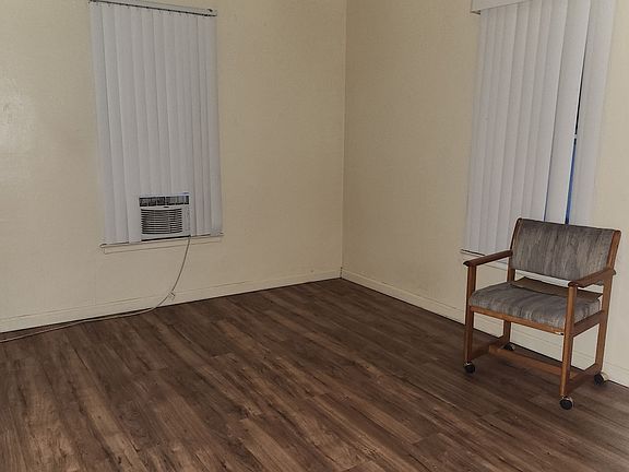 bright and airy bedroom with hardwood floors