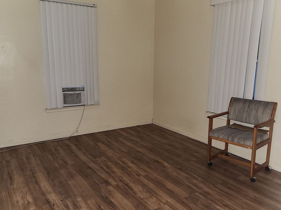 bright and airy bedroom with hardwood floors