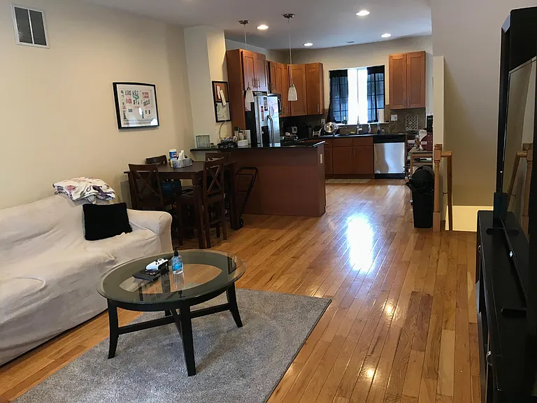 Bright and airy living space with hardwood floors and natural light throughout