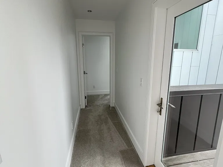 Hallway to fourth floor bedroom from fourth floor landing