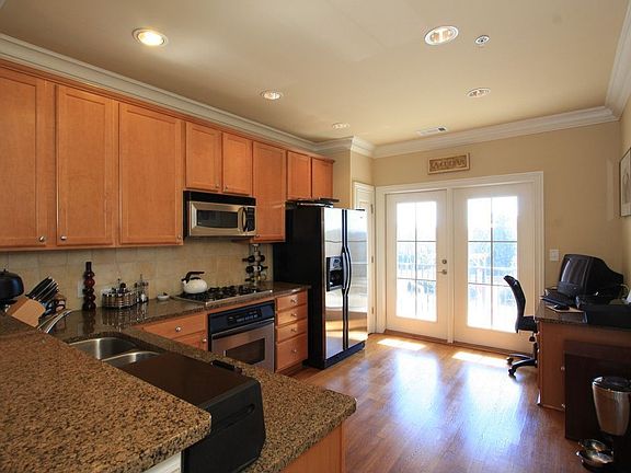 Kitchen has french doors leading to the covered patio.