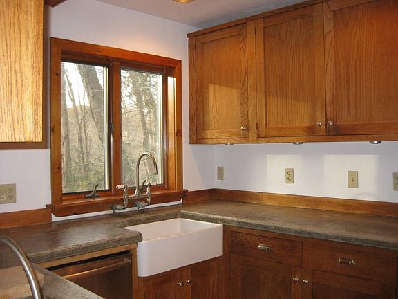 Kitchen, hand made oak cabinets, concrete counter tops and farmers sink