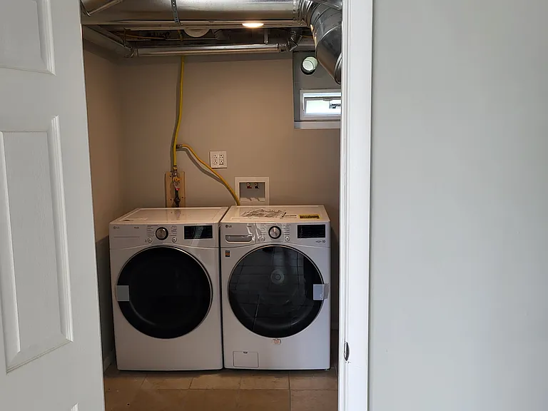 Utility room with laundry appliances