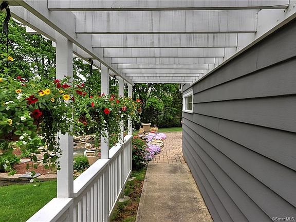 Pretty pergola leads you into the picturesque, private yard!