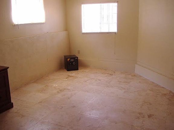 Office with travertine stone floors