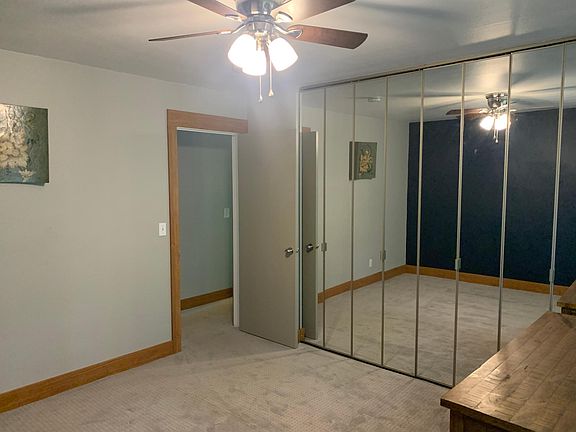 Second bedroom with mirrored closet doors