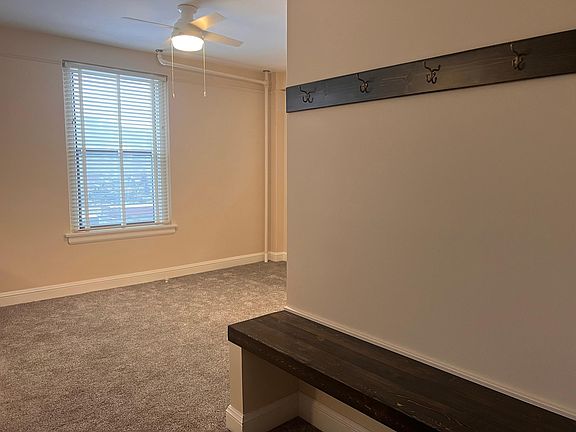 Apartment Entrance w/ built in bench and coat hanger.