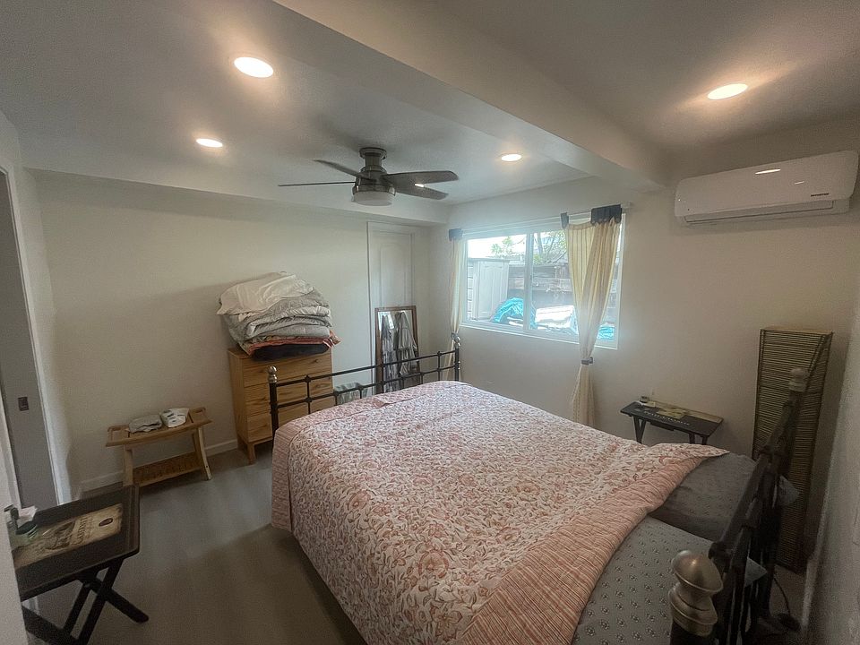 Full bedroom with queen bed, window, recessed lighting, ceiling fan/light and independent AC