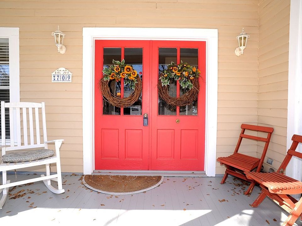 The front porch is ready with rockers for visits with neighbors & friends.