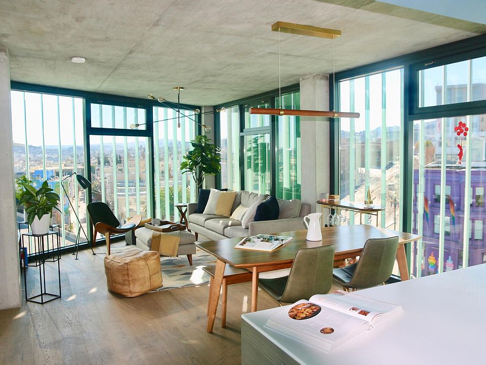 Spacious open dining and living space (great for entertaining!) with floor-to-ceiling window walls with sweeping city views (East, West and South) from this 7th floor corner unit