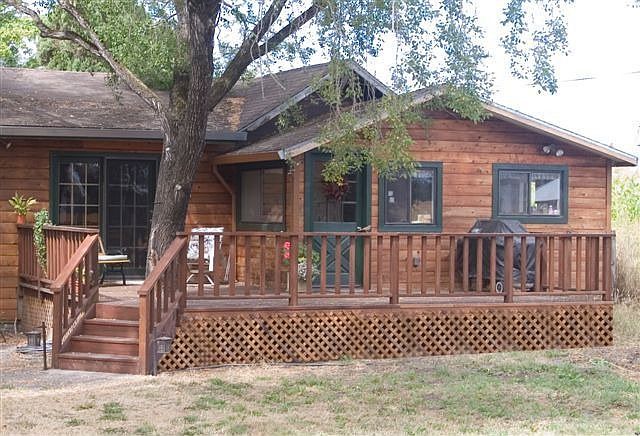 back of house with decking