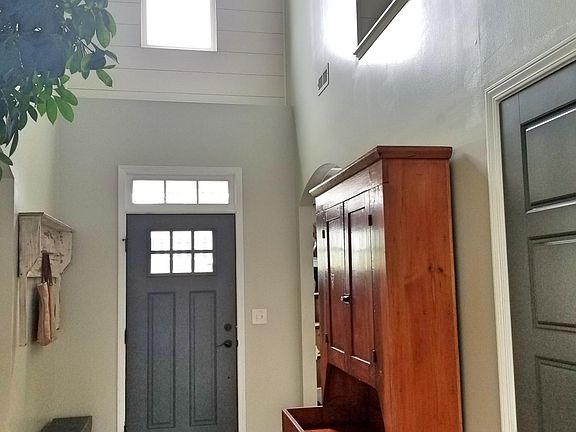 Beautiful 2-story foyer with "shiplap" accent wall in alcove