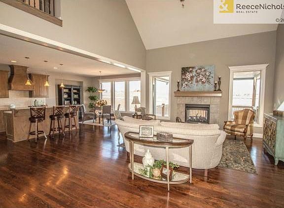 OPEN GREAT ROOM TO KITCHEN WITH SEE THROUGH FIREPLACE