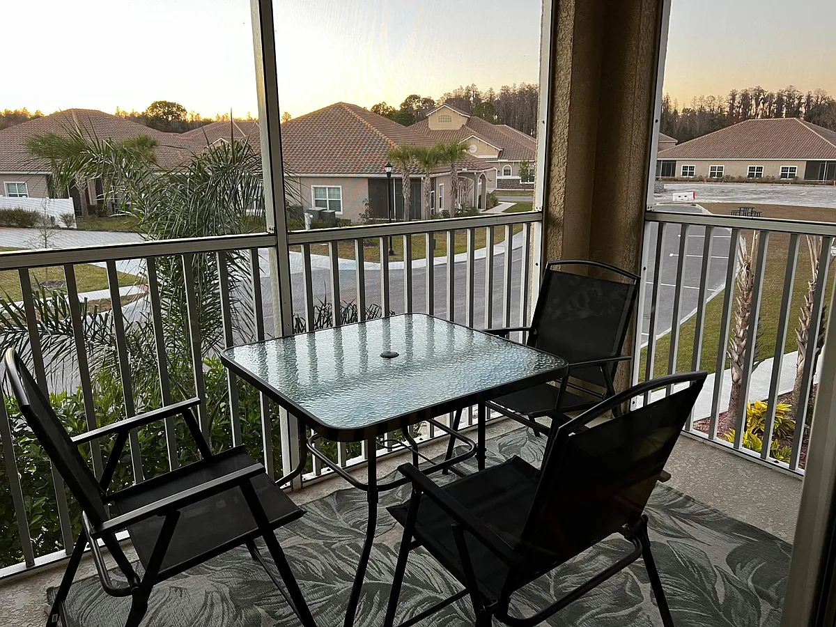 Patio with furniture. The patio is covered with a screen. - Godavari Way