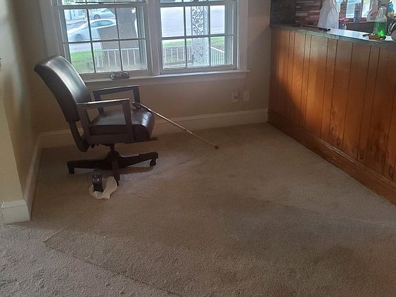 Diningroom with New Carpet and a Chair to rest my weiry bones / lol.