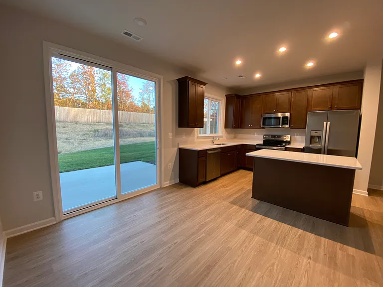Kitchen, Dining and Backyard view