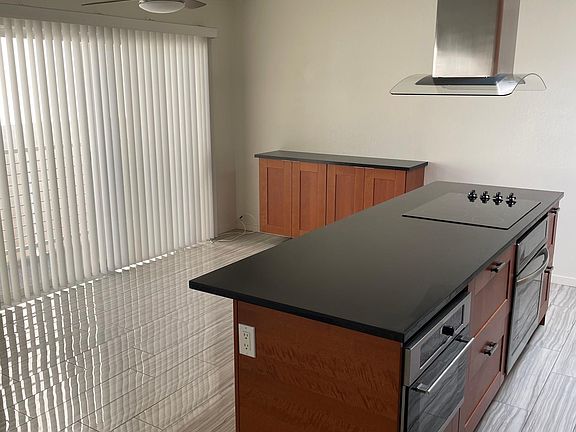 Closer look at the kitchen island and dining area with built in hutch.