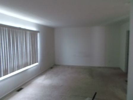 Master bedroom has attached sitting area, bathroom, and walk-in closet.