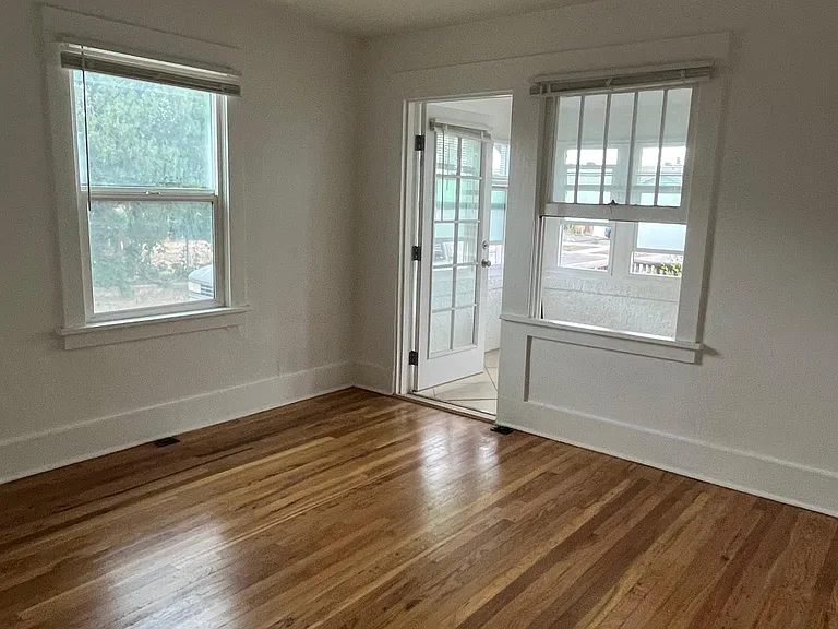 Bedroom looking out to sun-room