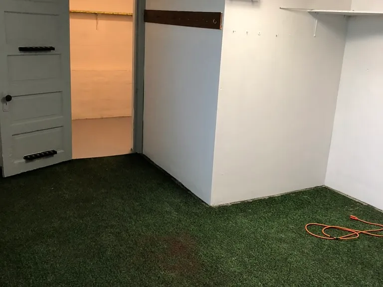 Basement carpet has been removed and floors have been painted