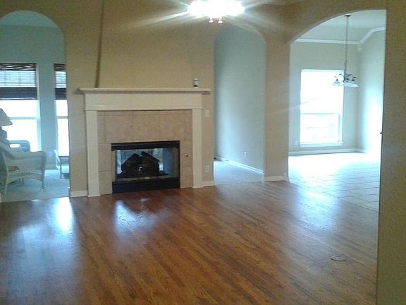 large family area w/ hardwood and two way fireplace