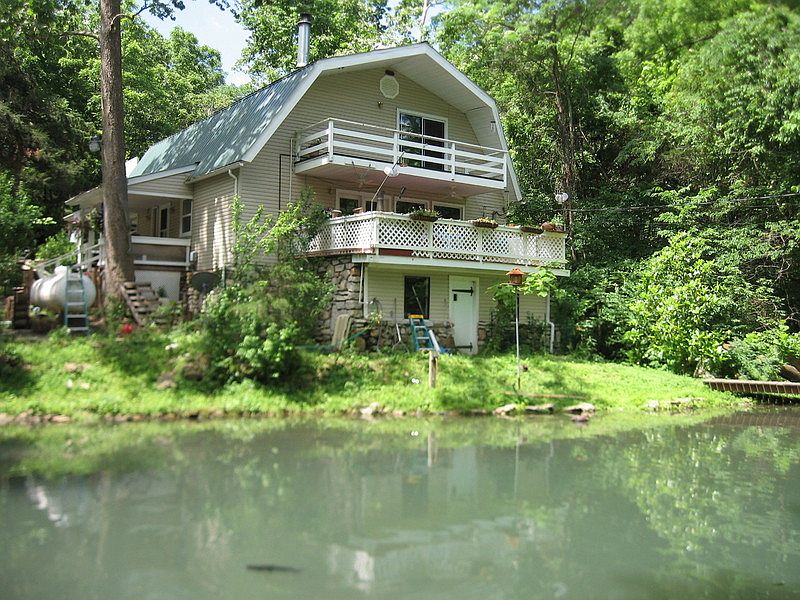 Exterior and pond
						:
						This property has a large pond and a creek flowing along side the property.