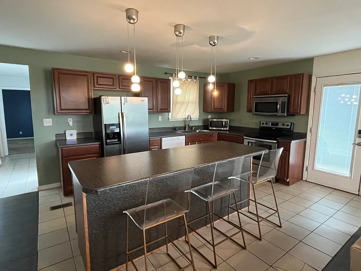 Kitchen withfarmhouse sink and large island. - 2231 Pennington Ave